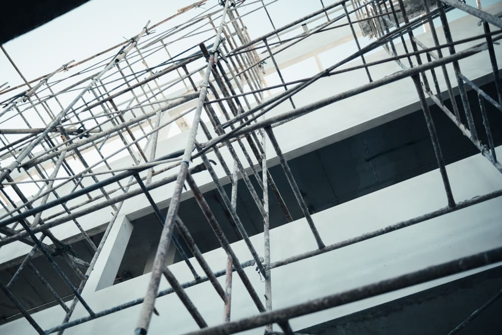 Metal scaffolding installed around a multistory building under construction